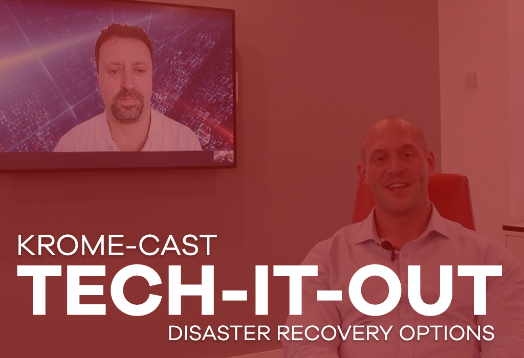 A man smiles in a red room featuring a presentation with another man discussing disaster recovery plan options on a screen. The text reads "krome-cast tech-it-out.