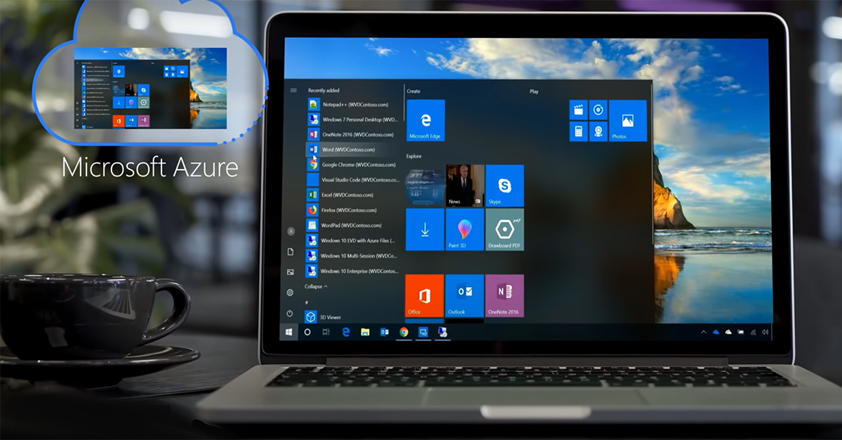 Laptop on a desk displaying Azure Virtual Desktop on the screen with a blurred background of office decor and a coffee cup in the foreground.