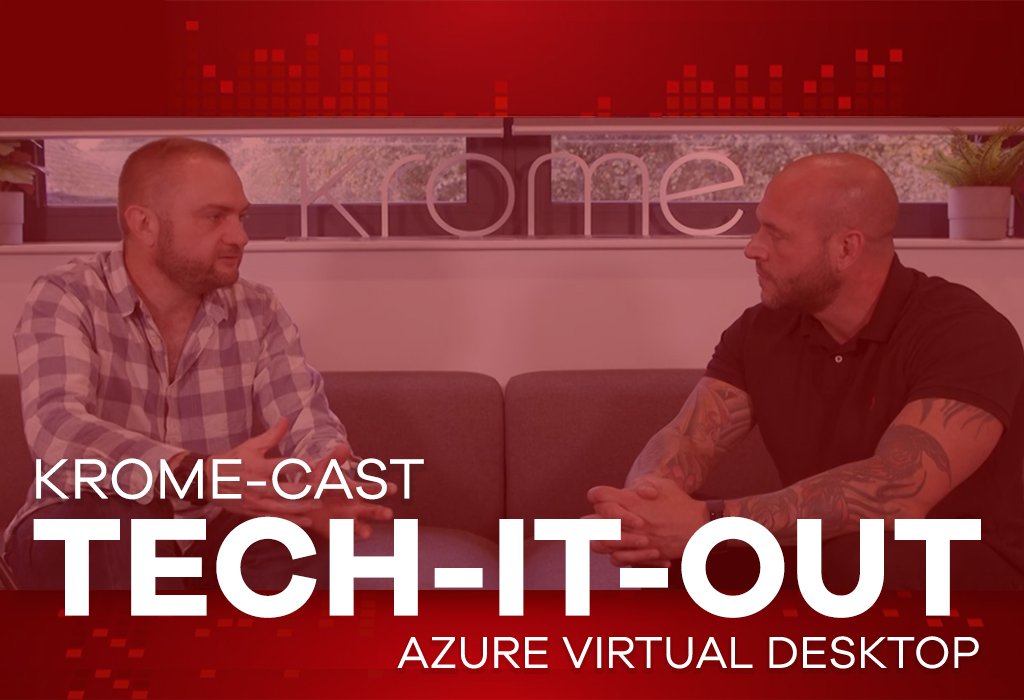 Two men engaging in a conversation in an office setting with a red backdrop displaying the text "Azure Virtual Desktop: Tech-it-Out.