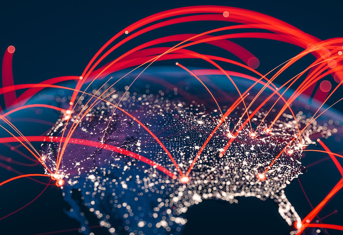 Digital illustration of red curved lines connecting various points on a stylized map of North America, representing IoT network or data connections on a dark background.